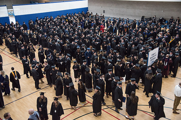 Graduates meet in the I-Center Courts for Processional before Commencement begins. April 2018