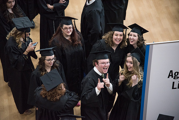 Graduates meet in the I-Center Courts for Processional before Commencement begins. April 2018