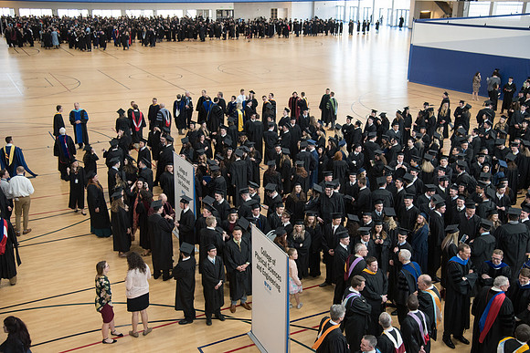 Graduates meet in the I-Center Courts for Processional before Commencement begins. April 2018