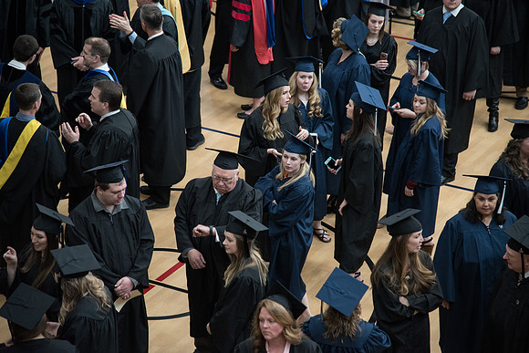 Graduates meet in the I-Center Courts for Processional before Commencement begins. April 2018