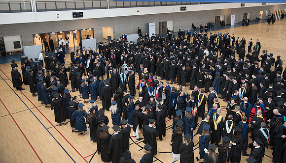 Graduates meet in the I-Center Courts for Processional before Commencement begins. April 2018