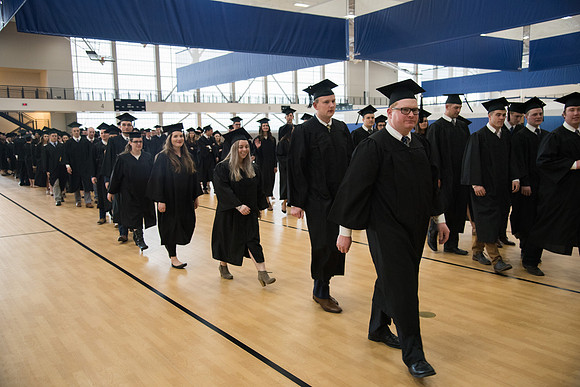 Graduates meet in the I-Center Courts for Processional before Commencement begins. April 2018