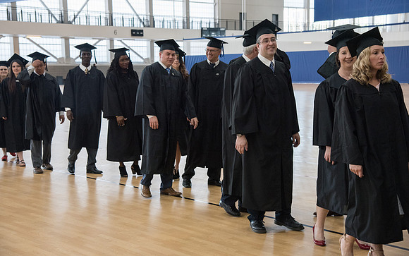 Graduates meet in the I-Center Courts for Processional before Commencement begins. April 2018