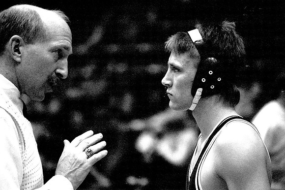 1989 Ricks College Wrestling coach Bob Christensen has a talk with one of his wrestlers.