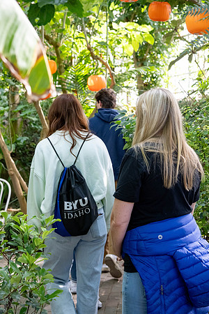 Employee giving a tour around campus to prospective students and their parents.