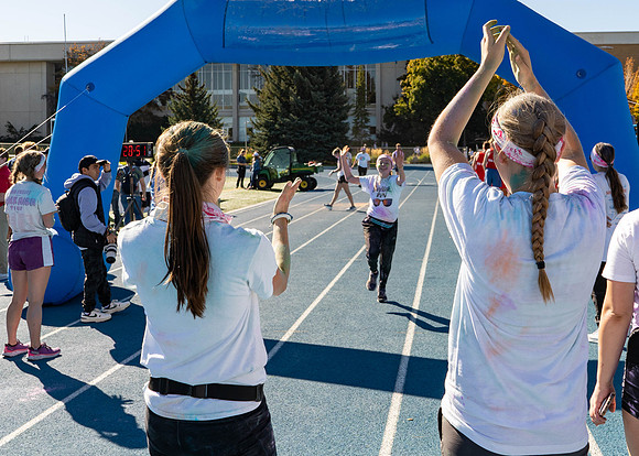 Students participate in the color run during spirit week, with free pancakes to follow.