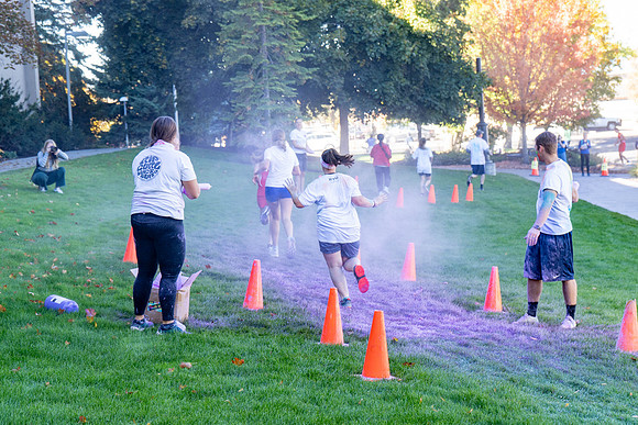 Students participate in the color run during spirit week, with free pancakes to follow.