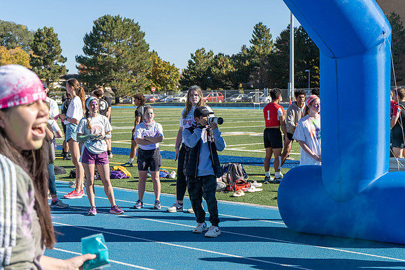 Students participate in the color run during spirit week, with free pancakes to follow.