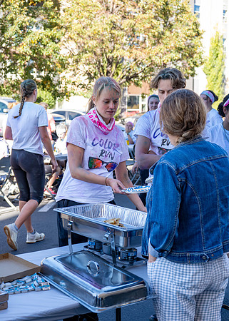 Students participate in the color run during spirit week, with free pancakes to follow.