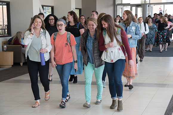 Students walking to Devotional. April 2018