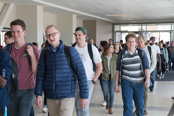 Students walking to Devotional. April 2018