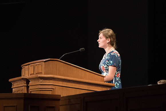 Student reads scripture for First Devotional of Spring Semester. April 2018
