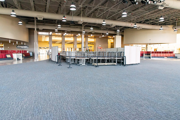 Tables and chairs stacked together so no one can use them during the Covid-19 Pandemic.