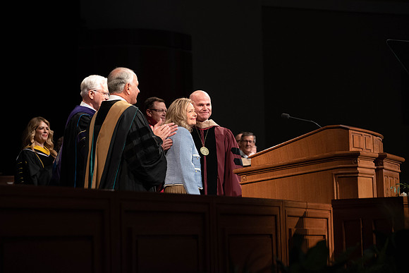President Alvin F. Meredith's Inauguration. Elder Rasband and Elder Christofferson present the medallion.