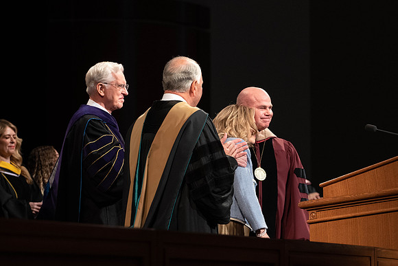 President Alvin F. Meredith's Inauguration. Elder Rasband and Elder Christofferson present the medallion.