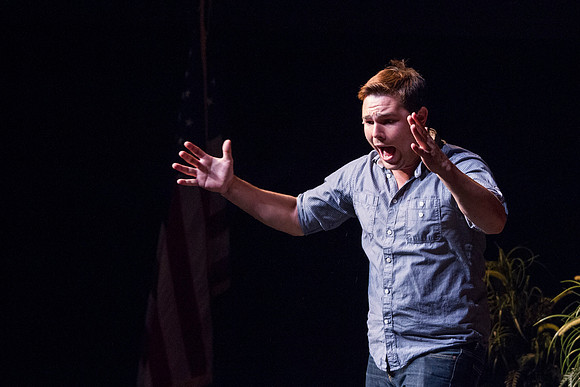 Cammerron Baits, Bachelor of Arts in Theatre Studies, with an emphasis in Performance, gives a monologue presentation during convocation in the Snow Building. Photo by Tyler Rickenbach