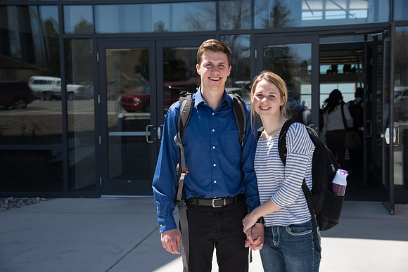 Students on campus by the Science & Technology Center Building, Spring Semester. April 2018