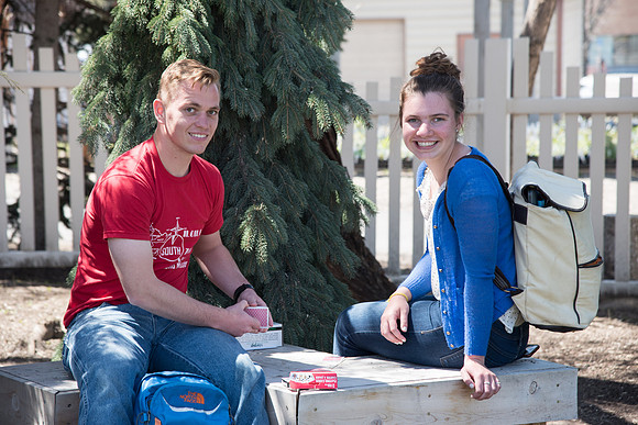 Students playing with cards on campus, Spring Semester. April 2018