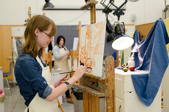 David Belka enthusiatically teaches painting principles to beginning painting class.