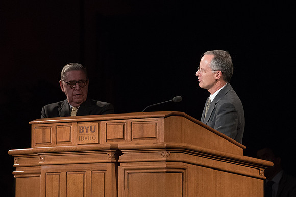 Jeffery R. Holland invites Elder Mathias Held to help answer a question that the married students asked in the I-Center. May 2018