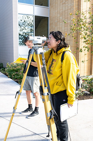 Students practicing surveying for Civil Engineering class.