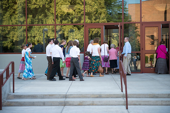 Audience members gather in auditorium for the preformance.