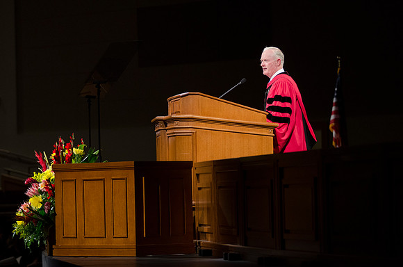 President Kim B. Clark gives a few remarks to the 2014 Winter Semester graduates during Commencement in the I-Center.