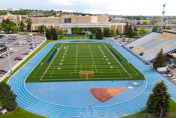 Drone aerial of BYU-Idaho campus football stadium.