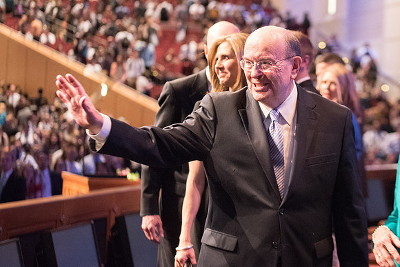 Elder Quentin L. Cook, Quorum of the Twelve Apostles, interacts with people after the Devotional.