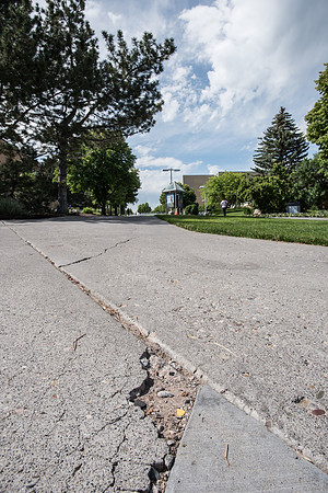 A sidewalk that has a crack in it at the BYU-Idaho Campus.