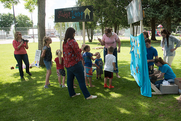 Student Living department employees and their families enjoy a picnic at Smith Park, to celebrate 10 years of being an organization.