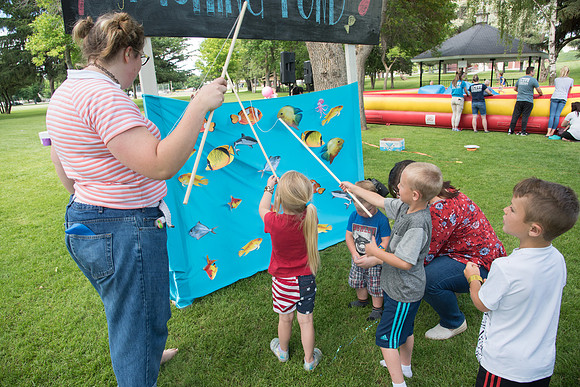 Student Living department employees and their families enjoy a picnic at Smith Park, to celebrate 10 years of being an organization.