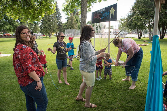 Student Living department employees and their families enjoy a picnic at Smith Park, to celebrate 10 years of being an organization.