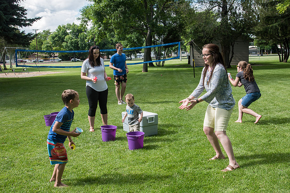 Student Living department employees and their families enjoy a picnic at Smith Park, to celebrate 10 years of being an organization.