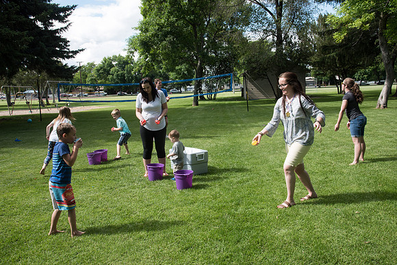 Student Living department employees and their families enjoy a picnic at Smith Park, to celebrate 10 years of being an organization.