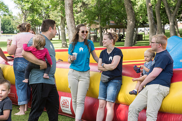 Student Living department employees and their families enjoy a picnic at Smith Park, to celebrate 10 years of being an organization.