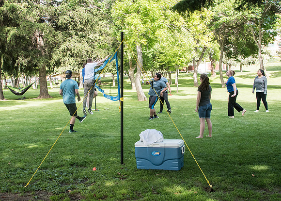 Student Living department employees and their families enjoy a picnic at Smith Park, to celebrate 10 years of being an organization.