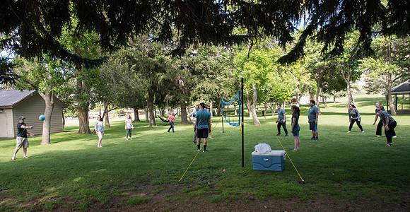 Student Living department employees and their families enjoy a picnic at Smith Park, to celebrate 10 years of being an organization.