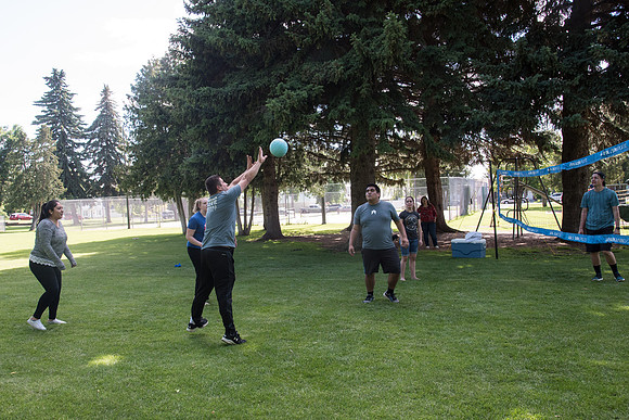 Student Living department employees and their families enjoy a picnic at Smith Park, to celebrate 10 years of being an organization.