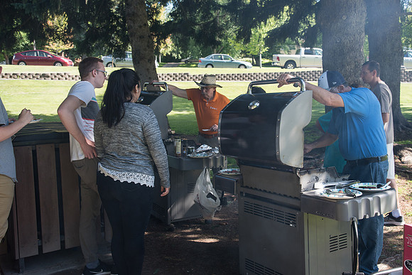 Student Living department employees and their families enjoy a picnic at Smith Park, to celebrate 10 years of being an organization.