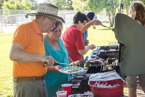 Student Living department employees and their families enjoy a picnic at Smith Park, to celebrate 10 years of being an organization.