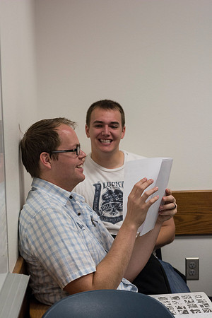 Two students in Sister Glenn's ENG 101 class, talk about their assignment during class in the 2014 Spring Semester.
