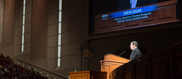 Drew Eager, a faculty member in the Departmant of Business Mangaement at BYU-Idaho speaking at devotional in the BYU-Idaho Center.