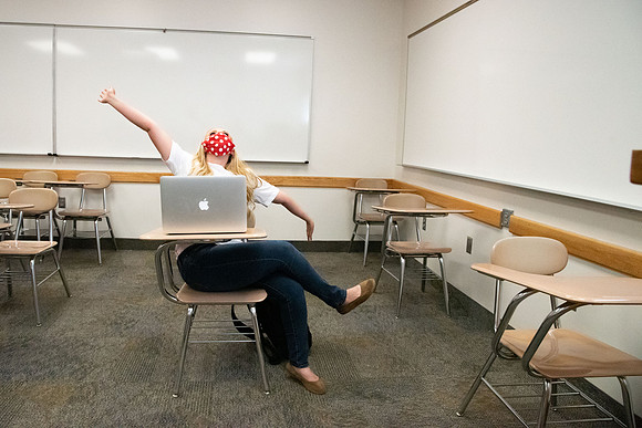 Examples of students staying safe and healthy during the COVID-19 pandemic by social distancing, following pathway arrows, and wearing face masks.