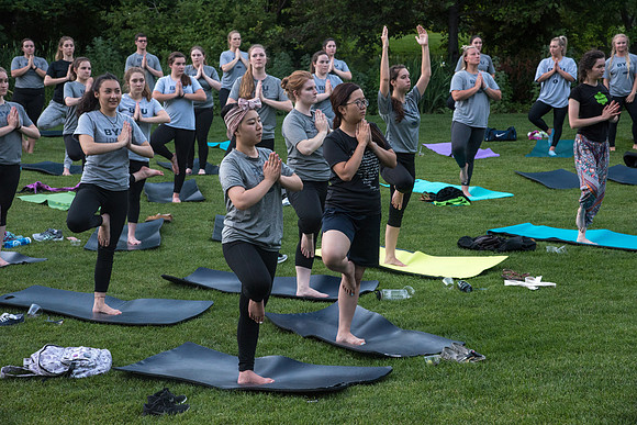 Students participate in the Yogathon activity in the Ricks Gardens on the BYU-Idaho Campus.