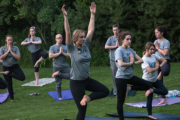 Students participate in the Yogathon activity in the Ricks Gardens on the BYU-Idaho Campus.