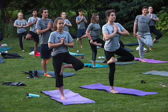Students participate in the Yogathon activity in the Ricks Gardens on the BYU-Idaho Campus.