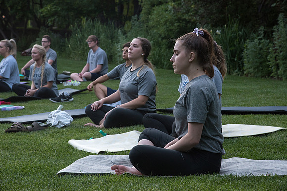 Students participate in the Yogathon activity in the Ricks Gardens on the BYU-Idaho Campus.