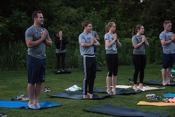 Students participate in the Yogathon activity in the Ricks Gardens on the BYU-Idaho Campus.