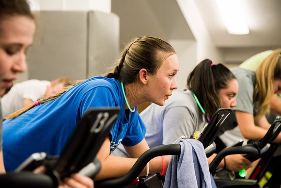 Students attend Cosmic Cycling Class at the Hart building.
